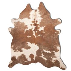 a brown and white cowhide rug on a white background