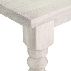 a white wooden table sitting on top of a hard wood floor