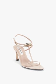 Presented in quiet but versatile Nude, the B Frame Sandal is an ideal day-to-night shoe. Featuring the brand’s iconic V-shaped sculptural heel in a new-season 75mm height, it is designed to ensure stability and wearability. An adjustable ankle strap brings added comfort, while a distinctive pointy toe and gold-tone B Frame detail add elevated points of difference.  Styled with the Frame Detail Shrunken Jumper and Cropped Kick Jean Victoria Beckham Frame Detail Sandal In Nude Leather  - Size 38 U Monthly Shopping, Holiday Essentials, Workout Gear, Victoria Beckham, V Shape, Wardrobe Essentials, Ankle Strap, Sandals Heels, Sandals