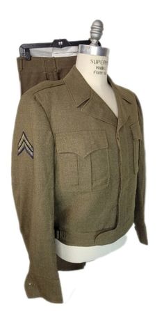 Here, for your consideration, is this beautiful WW2 Army NCO Corporal dress uniform. Comes complete with O.D. dress ike jacket and trousers. Found inside the pocket of the uniform is a inspection ticket. Great part of WW2 history. Ike jacket does have two Army shoulder patch with Corporal stripes. Please view photos as they are part of the description.  Measurements Coat: Shoulders 18 1/2" Sleeve 26"  Chest 46" Waist 40" Length 23 1/2" Trousers: Waist 32" + 2" Inseam 31" Outseam 42" hem 0" Cuff Formal Fitted Uniform With Long Sleeves, Formal Fitted Long Sleeve Uniform, Fitted Long Sleeve Military Uniforms, Fitted Long-sleeved Military Uniforms, Fitted Long Sleeve Uniforms For Fall, Ww2 History, Us Army, Tent, Dresser