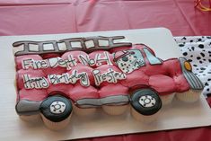 a decorated birthday cake with a red truck on the front and white lettering that says fire dept no 4, third birthday fiesta