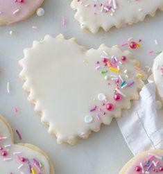 decorated sugar cookies with sprinkles and white frosting