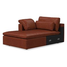 a brown leather couch with two pillows on it's back and one arm facing the camera