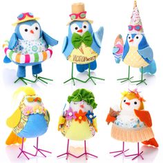 six small stuffed birds dressed in colorful clothing and hats, each with a name tag