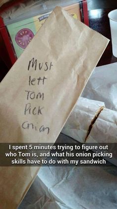 a brown paper bag with writing on it