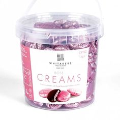 a container filled with pink ice creams on top of a white table