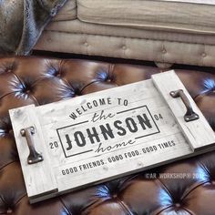 a welcome sign sitting on top of a leather couch