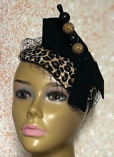 Leopard Teardrop Fascinator Half Hat for Tea Party, Church Head Covering, Wedding, and other Special Occasions  Cocktail Fascinator with net/veiling, hatpin and felt bow. Perfect for engagement parties, mother of the bride, anniversary, etc. The hatpin is for decorative purposes only. Suitable for all seasons: summer, fall, winter, and spring. Handmade Measures:  6X8 inches  SHIPPING All items for free shipping will be shipped via USPS FIRST CLASS MAIL. Vintage Black Fascinator For Party, Vintage Headband Costume Hat For Party, Vintage Costume Headband For Party, Gatsby Style Evening Fascinator Headband, Vintage Mini Hat Headband For Parties, Evening Gatsby Style Fascinator Headband, Vintage Party Headband Hair Accessories, Vintage Headband Hair Accessories For Party, Fitted Evening Fascinator Headband