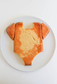 a piece of cake shaped like a dog on a plate