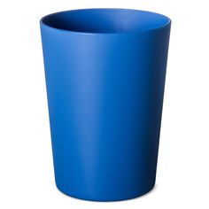 a blue cup sitting on top of a white table