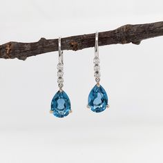 Teardrop London Blue Topaz in 14K Solid Gold w Natural Diamond Accents | Pear Shape 10x7mm | Secure Latch Back | Dangle Earrings | Blue Gems Elegant Teardrop Blue Topaz Earrings, Elegant Blue Topaz Teardrop Earrings, Elegant Blue Topaz Briolette Earrings, Teardrop Blue Topaz Earrings, Blue Topaz Earrings, Topaz Earrings, Blue Gems, Earrings Blue, Natural Earth