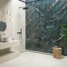 a bathroom with marble walls and flooring