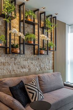 a living room filled with furniture and lots of windows