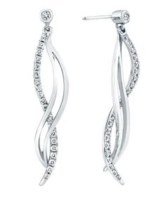 The Enchantment Earrings are 14kt white gold and feature 47 diamonds, totaling 0.50ctw. Platinum Diamond Earrings With Pave Setting For Wedding, Elegant Platinum Diamond Earrings With Halo Design, Platinum Bridal Earrings With Diamond Accents, Dazzling Diamond Earrings With Matching Pair, Diamond Earrings With Pave Setting For Anniversary, Dazzling Bridal Earrings In White Gold With Pave Setting, Sterling Silver Pave Setting Earrings For Anniversary, Dazzling Diamond Drop Earrings, Sterling Silver Earrings With Pave Setting For Anniversary