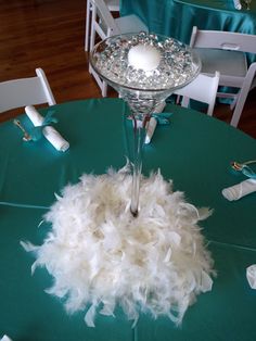 the centerpiece on this table is made out of feathers