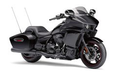 a black motorcycle is shown on a white background