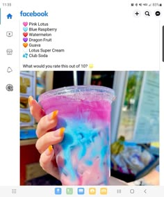 a person holding a pink and blue drink