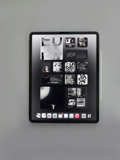 an image of a tablet with pictures on the screen and icons in black and white