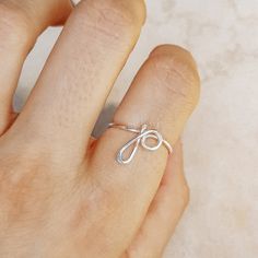 Delicate details make our Initial Ring in Silver a gorgeous addition to your finger! This beautiful piece is slim and trim, with a sweet cursive letter that lets you express yourself and to wear one on top of the other that make your look even more intriguing. This unique ring is made with gorgeous Sterling Silver for a beautiful shine that lasts. • Material: High Quality Sterling Silver 925, Gold Filled 12k, Rose Gold 12k• This ring is adjustable (you will receive it in the standard size US7, i Simple Adjustable Initial Ring, Personalized Initial Ring, Lowercase Letter, Gold N, Cursive Letters, Name Rings, Letter P, Initial Ring, Unique Ring