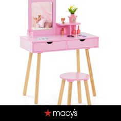 a pink desk with a mirror and stool on it that says may's toys