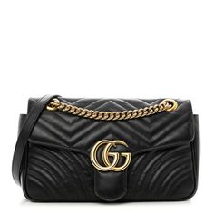 This is an authentic GUCCI Calfskin Matelasse Small GG Marmont Shoulder Bag in Black. This shoulder bag is made of soft calfskin leather in black. This handbag features aged gold chain shoulder straps, aged gold hardware, a Gucci GG logo closure, and a stitched heart on the back. The top opens to a beigefabric interior with a zipper pocket. Quilts Decor, Gg Logo, Classic Bags, Gg Marmont, Beige Fabric, Shoulder Bag Black, Shoulder Pads, Antique Gold, Gold Hardware