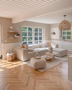 a living room filled with furniture and wooden floors