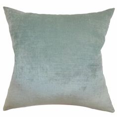 a light blue velvet pillow on a white background