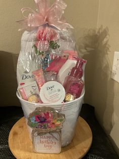 a basket filled with personal care items on top of a wooden table next to a wall