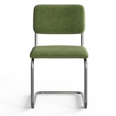 a green chair sitting on top of a white floor next to a black metal frame