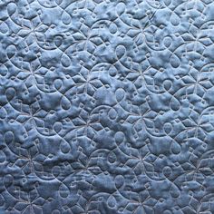 a close up view of a blue quilt