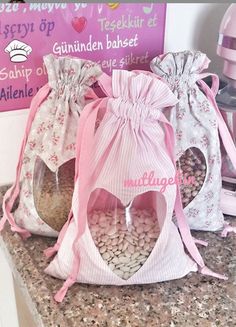 three bags filled with candy sitting on top of a counter