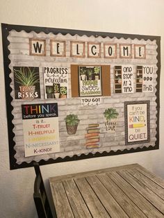 a wooden table sitting under a sign that says welcome to the people in this house