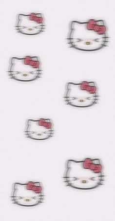 the hello kitty wallpaper is white and has red bows on it's head