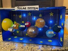 the solar system is made out of cardboard and string lights, which are attached to an outer case