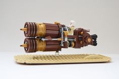 a lego model of a rocket ship on top of a keyboard