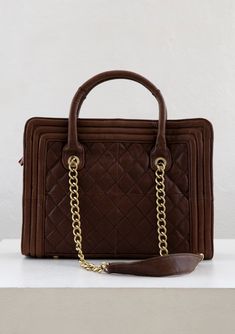 [Color: Brown] A genuine brown leather purse with a quilted exterior Classic Bag With Chain Strap And Double Handle, Classic Quilted Travel Bag, Timeless Quilted Business Bag, Elegant Quilted Business Bag, Classic Everyday Quilted Bag, Formal Quilted Tote Shoulder Bag, Classic Quilted Shoulder Bag For Daily Use, Quilted Leather Bag With Double Handle, Elegant Quilted Leather Bags