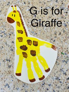 a giraffe made out of paper with the words giraffe on it