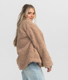 Crafted from faux fur sherpa fabric, this jacket envelops you in plush softness, making it perfect for chilly days and outdoor adventures. Maggie is 5’6” and is wearing a small Faux Fur Sherpa Jacket in Taupe.