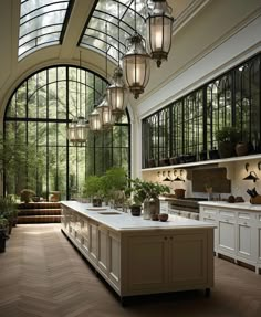 a large kitchen with lots of windows and lights