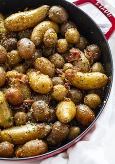 a pan filled with potatoes covered in seasoning