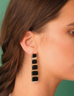 BEHIND THE DESIGN Big, bold and bright. This design showcases a cascade of gemstones light enough for you to wear comfortably throughout your day or night. The perfect statement earrings for your next special event! DETAILS Metals: 18ct Gold Plated: a thick layer of 18ct Gold over brass. Nickel-free. Stone: Natural black onyx gemstones and cubic zirconia Dimensions: 6 cm long / 2.3 inches length Weight: 10.9 grams Sold as a pair. This piece contains natural gemstones which may vary slightly in c Modern Party Earrings With Plating, Luxury Linear Evening Earrings, Modern Drop Earrings For Evening, Luxury Long Drop Linear Earrings For Party, Party Chandelier Earrings With Plating, Elegant Long Drop Earrings For Evening, Modern Earrings With Plating For Evening, Party Linear Earrings With Plating, Modern Evening Earrings With Plating