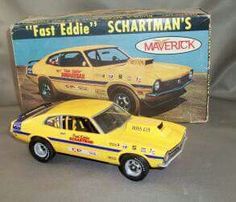 a yellow toy car in front of a box with an advertisement for the ford edge's scharttman's