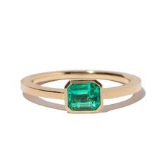 === The Classic Emerald ring is a timeless addition to your collection of jewelry. Featuring a stunning Emerald with a polished and brushed band. A goldfish is engraved on one side of the band to represent abundance and prosperity. Stone: Emerald (0.63 ct) Material: Recycled 18kt yellow gold Made in: Japan Resizable: yes Unsure of your size? Find your size at home Personalization: Custom Engraving Available === Say “I love you” with Milamore. A collection for gemstone lovers, featuring sapphires Emerald Cut Emerald Ring, Constellation Earrings, Hope Bracelet, Pave Diamond Ring, Emerald Necklace, Pave Ring, Diamond Bangle, Sapphire Necklace, Tennis Bracelet Diamond