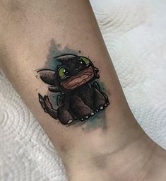 a cartoon character tattoo on the ankle