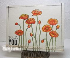 a card with orange flowers on it and the words thank you written in black ink