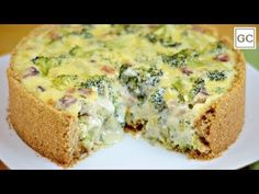 broccoli and cheese quiche on a white plate