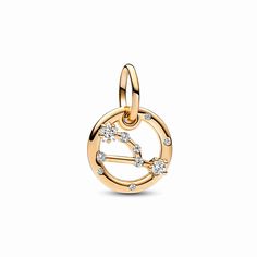 Let the stars guide your look with the Taurus Zodiac Dangle Charm. The dangle is crafted our 14k gold-plated unique metal blend, has a circular outer frame and features clear sparkling cubic zirconia as well as the shape of the Taurus zodiac sign. The back side of the frame is engraved with "Taurus".Loyal, trustworthy and strong-minded, the Taurus in your life can always be counted on to be good-natured, down-to-earth and tenacious. Wear this Pandora Moments Dangle Charm as a sign of your own sign's strength or give it as a gift of appreciation to the Taurus in your life. Pandora Charms Gold, Bracelet Pandora, Mesh Bracelet, Taurus Zodiac, Letter Charms, Dangle Charms, Pandora Bracelet, Pandora Charms, Shinee