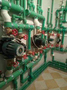 pipes and valves are connected to the wall