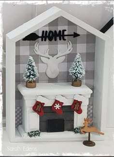 a fireplace with stockings and deer heads on it