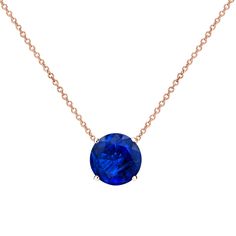 a necklace with a blue stone on it